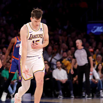 Feb 3, 2024; New York, New York, USA; Los Angeles Lakers guard Austin Reaves (15) celebrates his three point shot against New York Knicks guard Jalen Brunson (11) during the fourth quarter at Madison Square Garden. Mandatory Credit: Brad Penner-Imagn Images