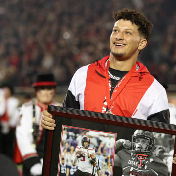 Oct 29, 2022; Lubbock, Texas, USA;  Kansas City Chiefs quarterback Patrick Mahomes II watches as his name is unveiled during his induction in the Ring of Honor at halftime of a game between the Texas Tech Red Raiders and the Baylor Bears at Jones AT&T Stadium and Cody Campbell Field. Mandatory Credit: Michael C. Johnson-USA TODAY Sports