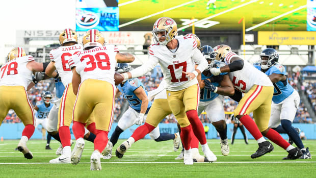 San Francisco 49ers quarterback Branden Allen (17) hands the ball off to running back Cody Schrader (38)