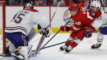 Apr 15, 2024; Detroit, Michigan, USA;  Detroit Red Wings right wing Patrick Kane (88) skates with the puck on Montreal Canadiens goaltender (35) while defended by Montreal Canadiens defenseman Justin Barron (52) in overtime at Little Caesars Arena. Mandatory Credit: Rick Osentoski-USA TODAY Sports