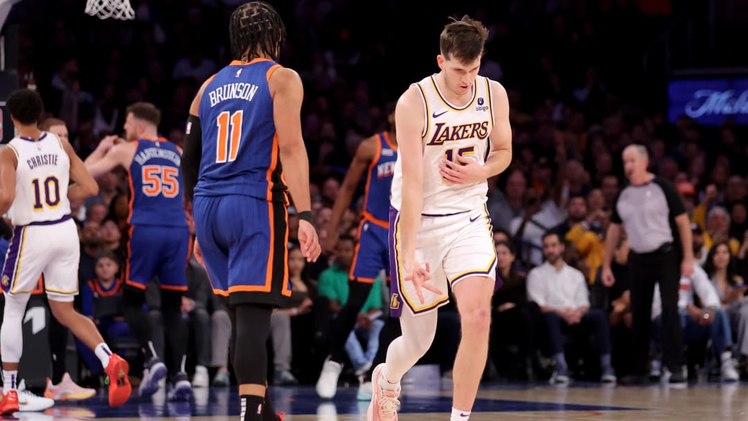Feb 3, 2024; New York, New York, USA; Los Angeles Lakers guard Austin Reaves (15) celebrates his three point shot against New York Knicks guard Jalen Brunson (11) during the fourth quarter at Madison Square Garden. Mandatory Credit: Brad Penner-USA TODAY Sports