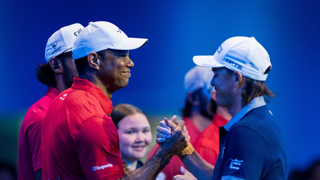 Tiger Woods of Jupiter Links and Rickie Fowler of New York Golf Club greet during a TGL match at SoFi Center