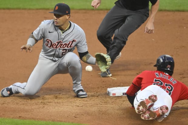 Bo Naylor slides in as he steals second base 