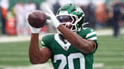 Sep 29, 2024; East Rutherford, New Jersey, USA; New York Jets running back Breece Hall (20) warms up before the game against the Denver Broncos at MetLife Stadium. 
