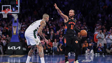 Nov 28, 2025; New York, New York, USA; New York Knicks guard Jalen Brunson (11) dribbles as Milwaukee Bucks forward Kyle Kuzma (18) defends during the second half at Madison Square Garden. Mandatory Credit: Vincent Carchietta-Imagn Images