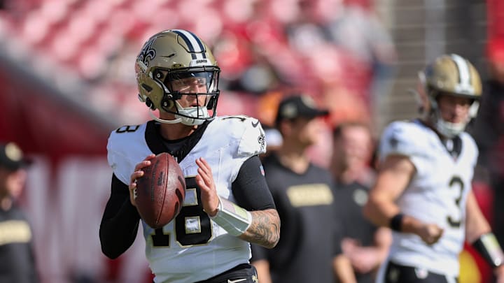 Jan 5, 2025; Tampa, Florida, USA; New Orleans Saints quarterback Spencer Rattler (18) warms up before a game against the Tampa Bay Buccaneers at Raymond James Stadium. Mandatory Credit: Nathan Ray Seebeck-Imagn Images