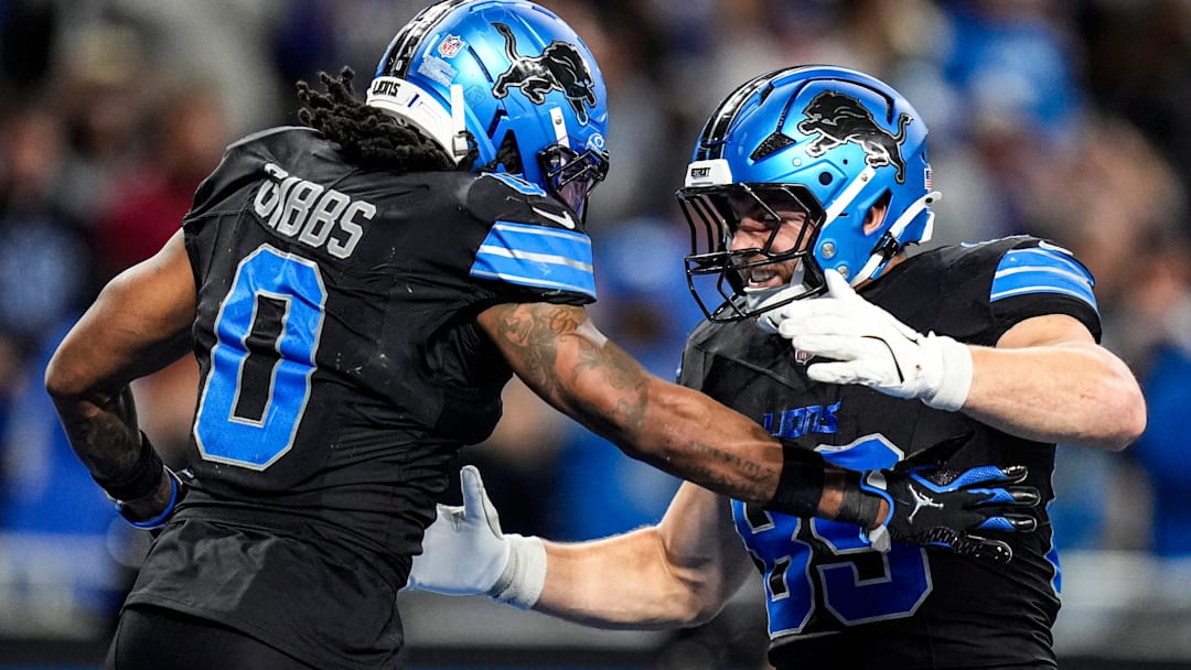 Detroit Lions running back Jahmyr Gibbs (0) celebrates a touchdown against New York Giants with tight end Brock Wright (89) during overtime at Ford Field in Detroit on Sunday, Nov. 23, 2025.