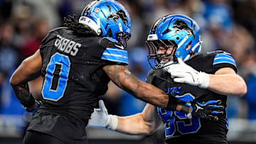 Detroit Lions running back Jahmyr Gibbs (0) celebrates a touchdown against New York Giants with tight end Brock Wright (89) during overtime at Ford Field in Detroit on Sunday, Nov. 23, 2025.