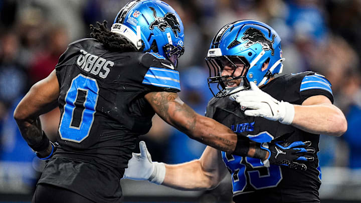 Detroit Lions running back Jahmyr Gibbs (0) celebrates a touchdown against New York Giants with tight end Brock Wright (89) during overtime at Ford Field in Detroit on Sunday, Nov. 23, 2025.
