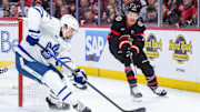 Apr 24, 2025; Ottawa, Ontario, CAN; Ottawa Senators left wing Brady Tkachuk (7) shoots the puck past Toronto Maple Leafs defenseman Simon Benoit (2) in game three of the first round of the 2025 Stanley Cup Playoffs at Canadian Tire Centre. Mandatory Credit: Marc DesRosiers-Imagn Images