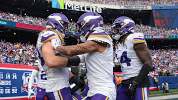 Linebacker Andrew Van Ginkel celebrates an interception with teammates to lock up a Vikings road win over the Giants.