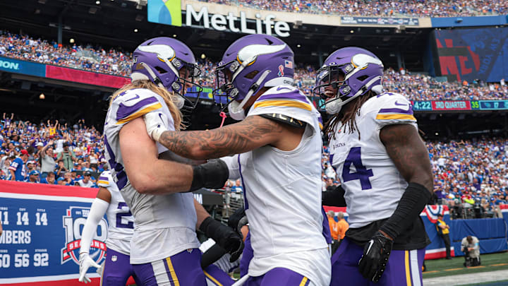 Linebacker Andrew Van Ginkel celebrates an interception with teammates to lock up a Vikings road win over the Giants.