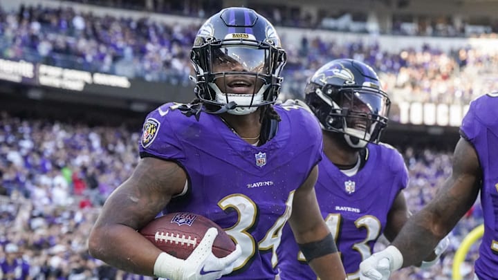 Nov 5, 2023; Baltimore, Maryland, USA;  Baltimore Ravens running back Keaton Mitchell (34) celebrates his touchdown against the Seattle Seahawks during the third quarter at M&T Bank Stadium. Mandatory Credit: Jessica Rapfogel-Imagn Images