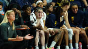 Jun 10, 2024; Uncasville, Connecticut, USA; Indiana Fever guard Caitlin Clark (22) on the bench with her teammates in the second half as they take on the Connecticut Sun at Mohegan Sun Arena. Mandatory Credit: David Butler II-USA TODAY Sports