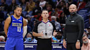 Feb 17, 2022; New Orleans, Louisiana, USA; Dallas Mavericks guard Jalen Brunson (13) and Dallas Mavericks head coach Jason Kidd are talked to by a referee against the New Orleans Pelicans during the second half at the Smoothie King Center. Mandatory Credit: Stephen Lew-Imagn Images