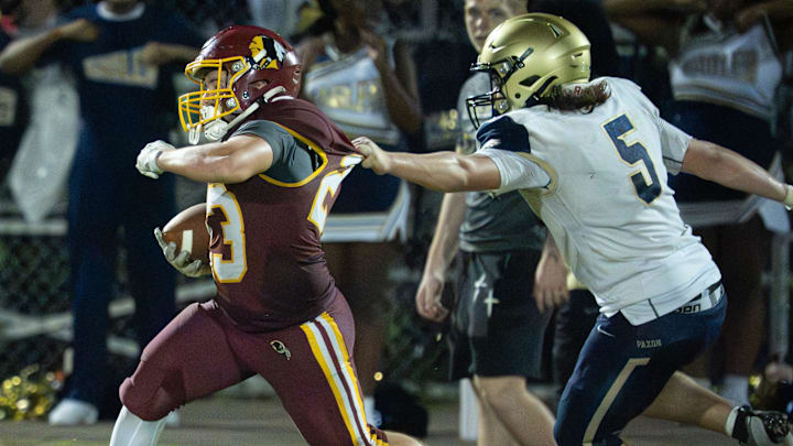 West Nassau Warriors running back Skyler Freeman (23) breaks a tackle from Paxon Diego Bocanergra while on his way to a second half touchdown. Paxon Golden Eagles played the West Nassau Warriors in the opening week of high school football Friday August 15, 2025 at Hilliard Middle-Senior High School in Hilliard, Fla. [Doug Engle/Florida Times-Union]