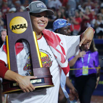Oklahoma outfielder Jayda Coleman (24) poses for a photo with the trophy after winning Game 2 of the NCAA softball Women's College World Series Championship Series game between the Oklahoma Sooners (OU) and Texas Longhorns at Devon Park in Oklahoma City, Thursday, June 6, 2024. Oklahoma won 8-4.