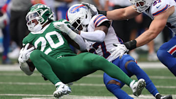 Sep 14, 2025; East Rutherford, New Jersey, USA; Buffalo Bills cornerback Tre'Davious White (27) tackles New York Jets running back Breece Hall (20) during the first half at MetLife Stadium. Mandatory Credit: Vincent Carchietta-Imagn Images