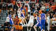 Jan 16, 2024; Stillwater, Oklahoma, USA; Oklahoma State Cowboys guard Connor Dow (13) collides with Kansas Jayhawks guard Johnny Furphy (10) under the basket during the second half at Gallagher-Iba Arena. Mandatory Credit: William Purnell-Imagn Images