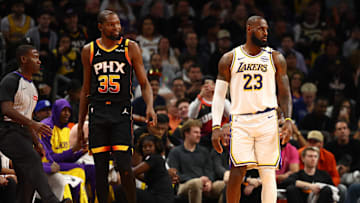 Nov 26, 2024; Phoenix, Arizona, USA; Los Angeles Lakers forward LeBron James (23) against Phoenix Suns forward Kevin Durant (35) during an NBA Cup game at Footprint Center. Mandatory Credit: Mark J. Rebilas-Imagn Images