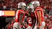 Sep 7, 2024; Columbus, Ohio, USA; Ohio State Buckeyes wide receiver Jeremiah Smith (4) celebrates scoring a touchdown with wide receiver Emeka Egbuka (2) and quarterback Will Howard (18) during the first half of the NCAA football game at Ohio Stadium.