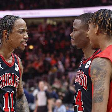 Dec 28, 2022; Chicago, Illinois, USA; Chicago Bulls forward DeMar DeRozan (11) celebrates with  forward Javonte Green (24) and forward Dalen Terry (25) team's win against the Milwaukee Bucks in overtime at United Center. Mandatory Credit: Kamil Krzaczynski-Imagn Images
