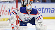 Nov 17, 2025; Buffalo, New York, USA;  Edmonton Oilers goaltender Stuart Skinner (74) looks to cover ups the puck during the second period against the Buffalo Sabres at KeyBank Center. Mandatory Credit: Timothy T. Ludwig-Imagn Images
