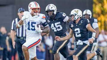 Auburn defensive end Keldric Faulk (15) runs after recovering a Vanderbilt fumble during the second quarter at FirstBank Stadium in Nashville, Tenn., Saturday, Nov. 8, 2025.