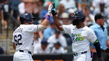 Tampa Bay Rays third baseman Junior Caminero (13) celebrates with first baseman Jonathan Aranda (62) after hitting a home run against the Detroit Tigers in the fourth inning at George M. Steinbrenner Field. Nathan Ray Seebeck-Imagn Images