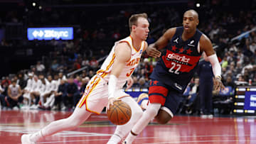 Nov 25, 2025; Washington, District of Columbia, USA; Atlanta Hawks guard Luke Kennard (3) drives to the basket as Washington Wizards forward Khris Middleton (22) defends in the first half at Capital One Arena. Mandatory Credit: Geoff Burke-Imagn Images