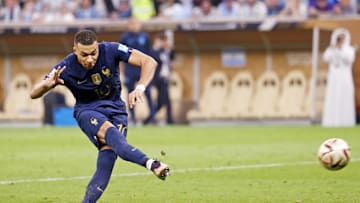 Dec 18, 2022; Lusail, Qatar; France forward Kylian Mbappe (10) shoots the ball during a penalty shootout in the 2022 World Cup final at Lusail Stadium. Mandatory Credit: Yukihito Taguchi-Imagn Images