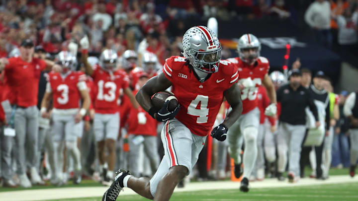 Dec 6, 2025; Indianapolis, IN, USA; Ohio State Buckeyes wide receiver Jeremiah Smith (4) runs against the Indiana Hoosiers in the second quarter during the 2025 Big Ten championship game at Lucas Oil Stadium. Mandatory Credit: Trevor Ruszkowski-Imagn Images