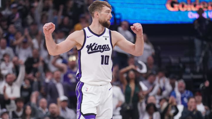 Apr 16, 2024; Sacramento, California, USA; Sacramento Kings forward Domantas Sabonis (10) reacts after the Kings made a basket against the Golden State Warriors in the first quarter during a play-in game of the 2024 NBA playoffs at the Golden 1 Center. Mandatory Credit: Cary Edmondson-USA TODAY Sports