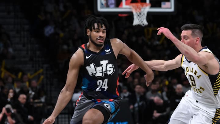 Apr 3, 2024; Brooklyn, New York, USA; Brooklyn Nets guard Cam Thomas (24) drives to the basket while being defended by Indiana Pacers guard T.J. McConnell (9) during the third quarter at Barclays Center. Mandatory Credit: John Jones-USA TODAY Sports