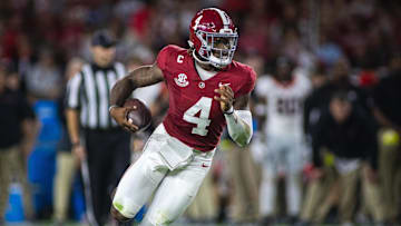 Sep 28, 2024; Tuscaloosa, Alabama, USA;  Alabama Crimson Tide quarterback Jalen Milroe (4) runs against the Georgia Bulldogs during the first quarter at Bryant-Denny Stadium. Mandatory Credit: Will McLelland-Imagn Images