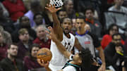 Dec 3, 2025; Cleveland, Ohio, USA; Cleveland Cavaliers center Evan Mobley (4) defends a shot by Portland Trail Blazers guard Shaedon Sharpe (17) in the fourth quarter at Rocket Arena. Mandatory Credit: David Richard-Imagn Images