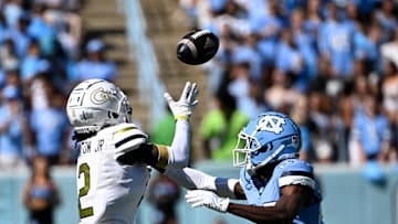 Oct 12, 2024; Chapel Hill, North Carolina, USA;  Georgia Tech Yellow Jackets wide receiver Eric Singleton Jr. (2) attempts to catche the ball as North Carolina Tar Heels linebacker Power Echols (23) defends in the first quarter at Kenan Memorial Stadium. Mandatory Credit: Bob Donnan-Imagn Images