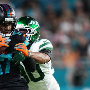 Miami Dolphins wide receiver Jaylen Waddle (17) makes a catch against New York Jets cornerback Michael Carter II (30) during the first half at Hard Rock Stadium on Monday night, September 29, 2025.
