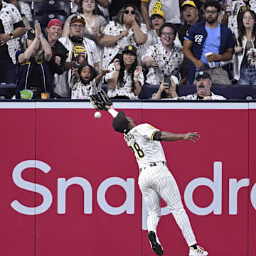 Jun 20, 2024; San Diego, California, USA; San Diego Padres left fielder Jose Azocar (28) cannot catch the RBI double hit by Milwaukee Brewers designated hitter Rhys Hoskins (not pictured) during the ninth inning at Petco Park. Mandatory Credit: Orlando Ramirez-Imagn Images