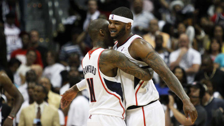 May 8, 2011; Atlanta, GA, USA; Atlanta Hawks guard Jamal Crawford (11) hugs power forward Josh Smith (5) as the Hawks win the game 100-88 against the Chicago Bulls at Philips Arena. Mandatory Credit: Daniel Shirey-USA TODAY Sports