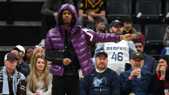 Jan 15, 2024; Memphis, Tennessee, USA; Memphis Grizzlies guard Ja Morant (12) reacts from the bench during the first half against the Golden State Warriors at FedExForum. Mandatory Credit: Petre Thomas-USA TODAY Sports