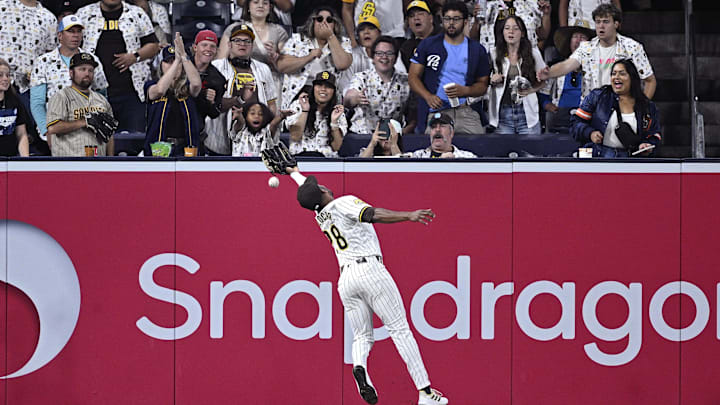 Jun 20, 2024; San Diego, California, USA; San Diego Padres left fielder Jose Azocar (28) cannot catch the RBI double hit by Milwaukee Brewers designated hitter Rhys Hoskins (not pictured) during the ninth inning at Petco Park. Mandatory Credit: Orlando Ramirez-Imagn Images