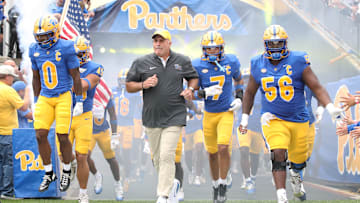 Sep 6, 2025; Pittsburgh, Pennsylvania, USA;  Pittsburgh Panthers running back Desmond Reid (0), head coach Pat Narduzzi, defensive back Javon McIntyre (7) and offensive lineman Lyndon Cooper (56) lead the Panthers onto the field to play the Central Michigan Chippewas  at Acrisure Stadium. Mandatory Credit: Charles LeClaire-Imagn Images
