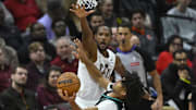 Dec 3, 2025; Cleveland, Ohio, USA; Cleveland Cavaliers center Evan Mobley (4) defends a shot by Portland Trail Blazers guard Shaedon Sharpe (17) in the fourth quarter at Rocket Arena. Mandatory Credit: David Richard-Imagn Images