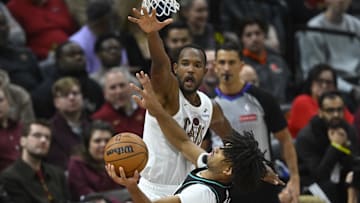 Dec 3, 2025; Cleveland, Ohio, USA; Cleveland Cavaliers center Evan Mobley (4) defends a shot by Portland Trail Blazers guard Shaedon Sharpe (17) in the fourth quarter at Rocket Arena. Mandatory Credit: David Richard-Imagn Images