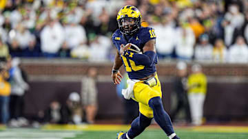 Michigan quarterback Alex Orji (10) runs against Oregon during the second half at Michigan Stadium in Ann Arbor on Saturday, Nov. 2, 2024.