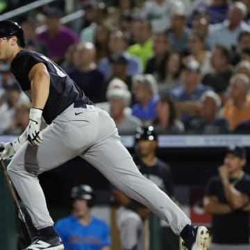 Mar 4, 2024; Jupiter, Florida, USA; New York Yankees outfielder Spencer Jones (78) hits a single against the Miami Marlins during the fifth inning at Roger Dean Chevrolet Stadium.