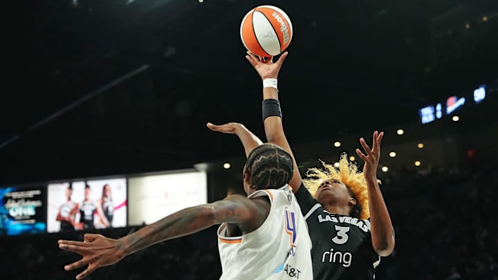Oct 3, 2025; Las Vegas, Nevada, USA; Las Vegas Aces forward NaLyssa Smith (3) shoots against Phoenix Mercury forward Natasha Mack (4) during the third quarter of game one of the 2025 WNBA Finals at Michelob Ultra Arena. Mandatory Credit: Stephen R. Sylvanie-Imagn Images