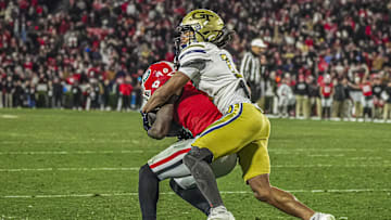 Nov 29, 2024; Athens, Georgia, USA; Georgia Bulldogs wide receiver Dominic Lovett (6) catches a touchdown pass in front of Georgia Tech Yellow Jackets defensive back Syeed Gibbs (16) during the second half at Sanford Stadium. Mandatory Credit: Dale Zanine-Imagn Images