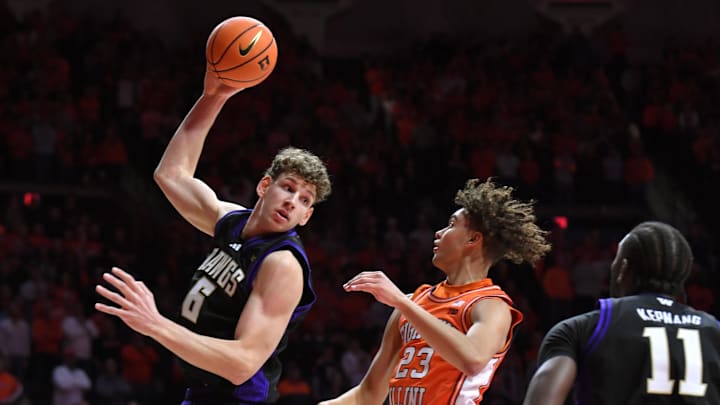 Jan 29, 2026; Champaign, Illinois, USA;  Washington Huskies forward Hannes Steinbach (6) grabs rebound from Illinois Fighting Illini guard Keaton Wagler (23) during the first half at State Farm Center. Mandatory Credit: Ron Johnson-Imagn Images